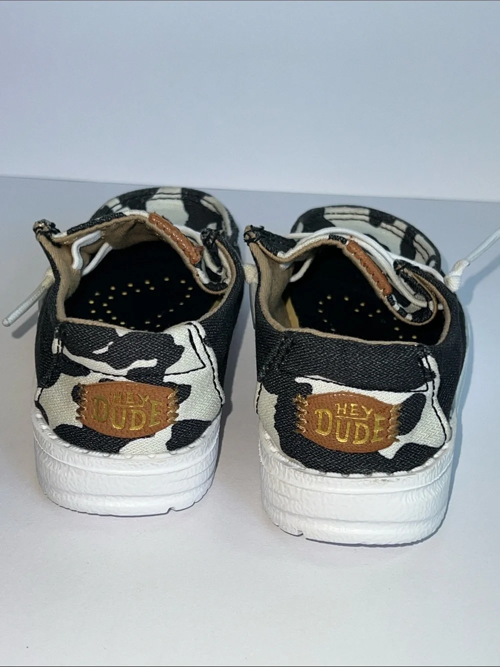 Hey Dude Wendy Black and White Cow Print Slip-On Loafers